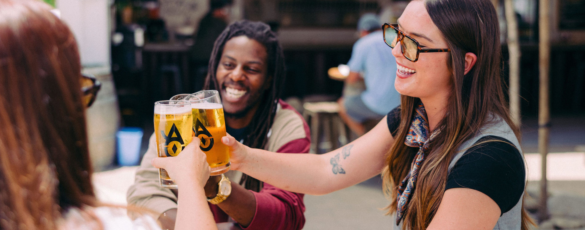 Friends drinking beer at Ancient Owl Beer Garden