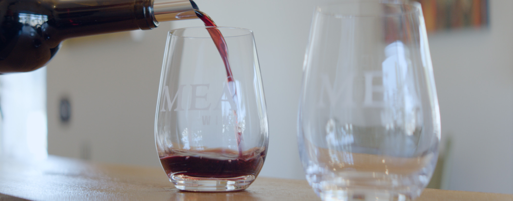 Red wine being poured at MEA Wines