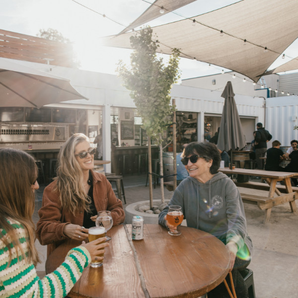 Women enjoying a beer at Ancient Owl in Atascadero