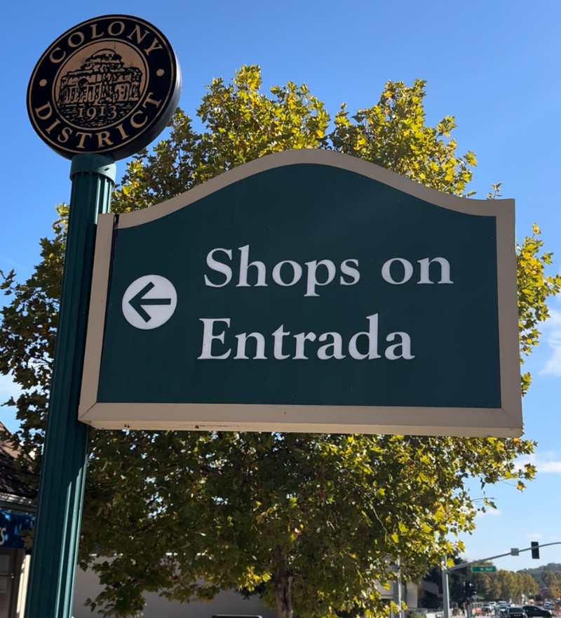 Sign pointing to Shops on Entrada Street in downtown Atascadero, California
