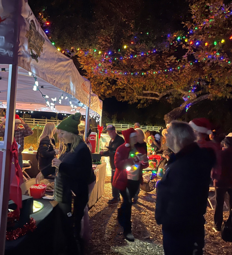A crowd gathers for the holiday musical walk around the lake in Atascadero
